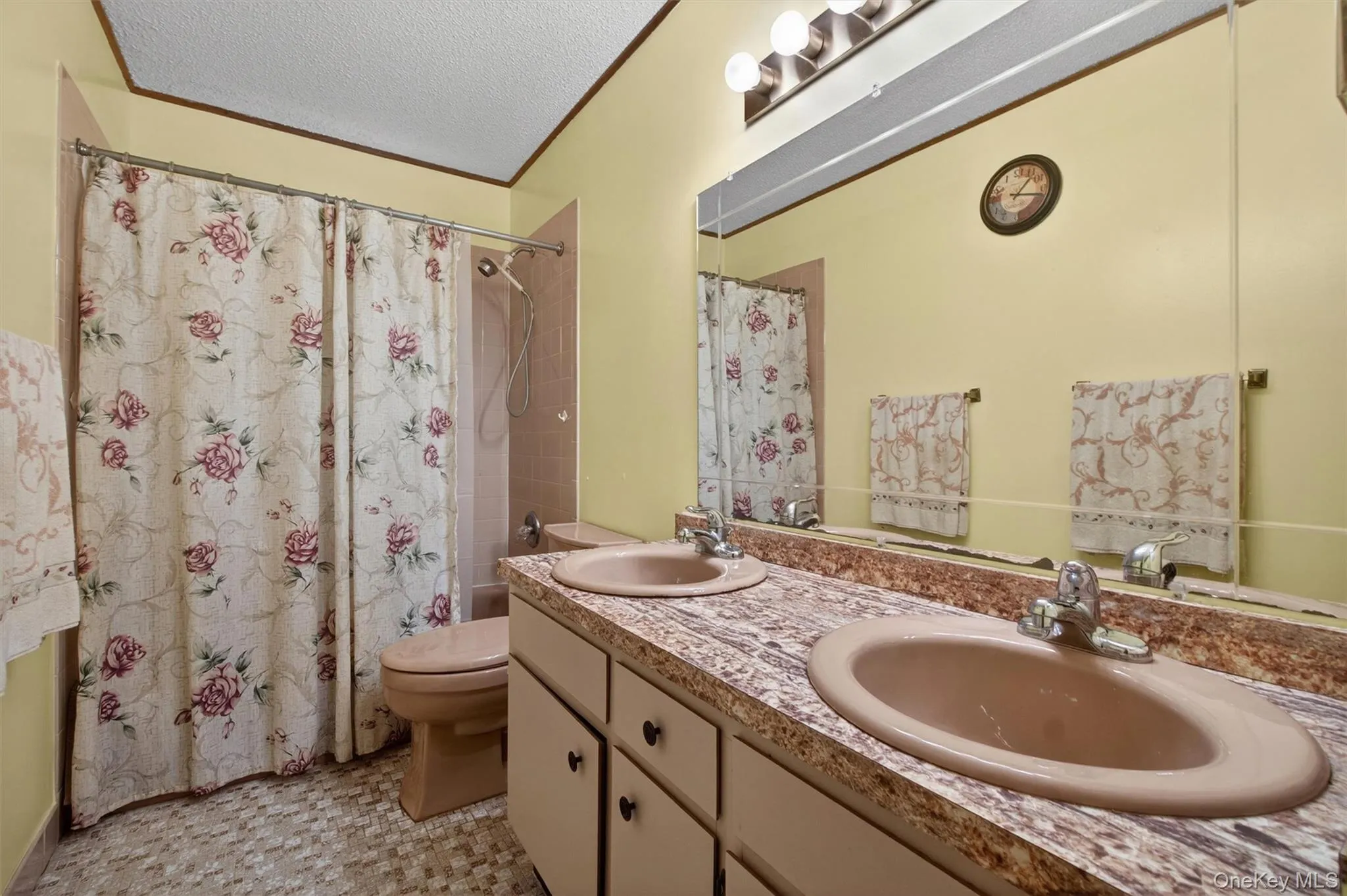 The second full bathroom has a double vanity and tiled tub/shower. The second full bathroom has a double vanity and tiled tub/shower.