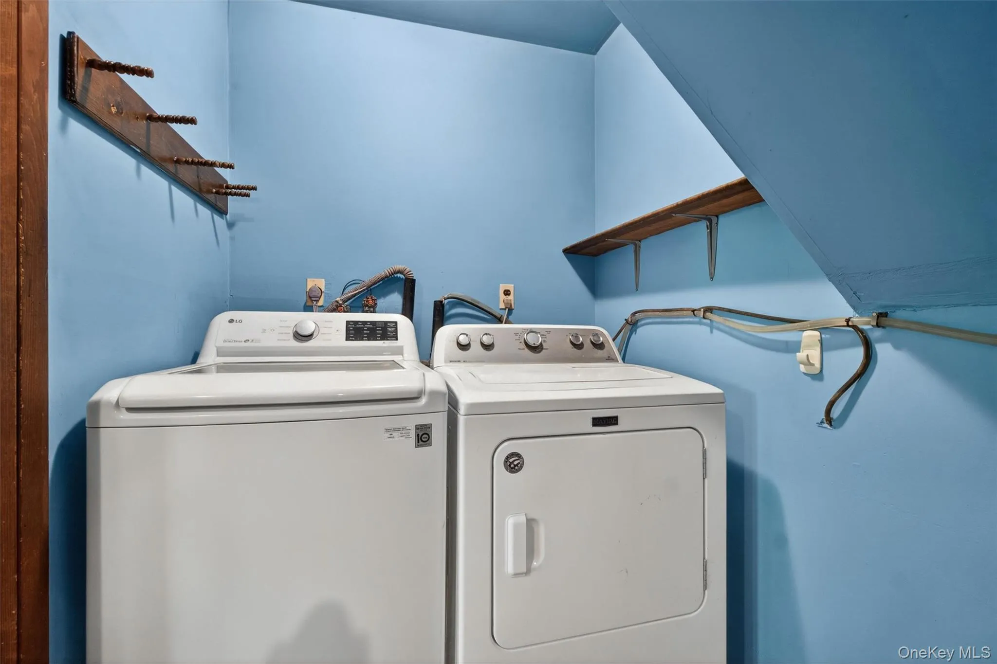 The laundry room was freshly painted and offers space for supplies. The laundry room was freshly painted and offers space for supplies.
