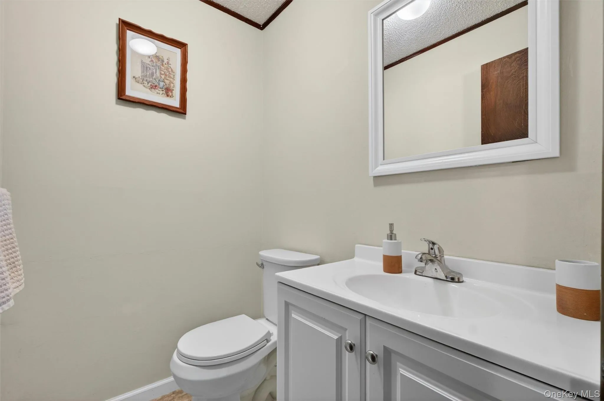 The lower level features an updated half bath. The lower level features an updated half bath.