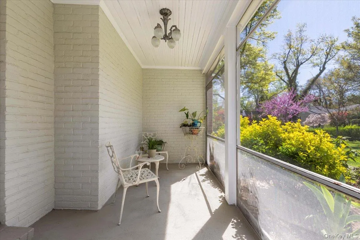 Solarium accessed directly from the living room offering a sunlit retreat Solarium accessed directly from the living room offering a sunlit retreat