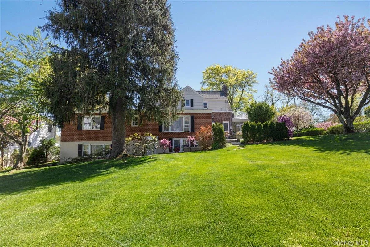 Back of property with beautiful lawn Back of property with beautiful lawn