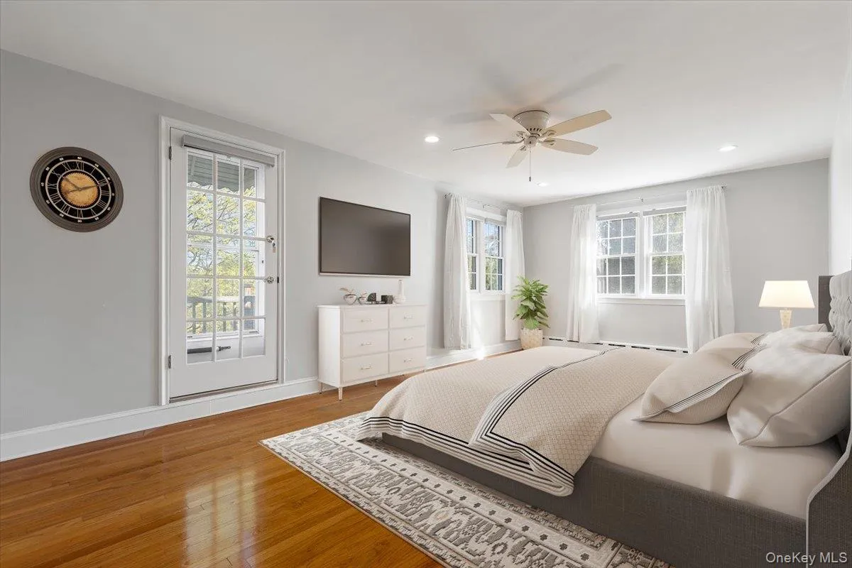 Virtually Staged Spacious Primary Bedroom on 2nd Floor with door to the balcony Virtually Staged Spacious Primary Bedroom on 2nd Floor with door to the balcony