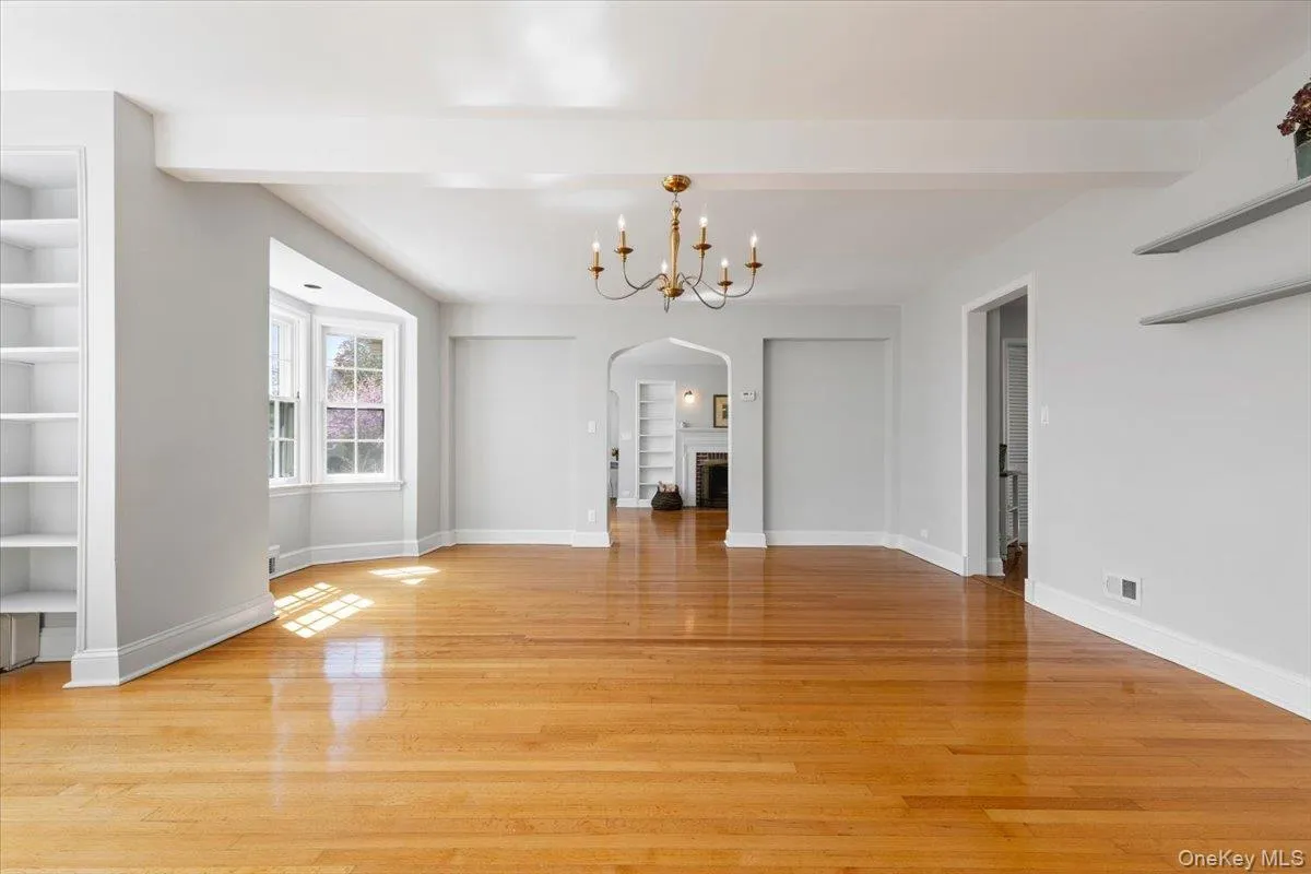 Dining Room showing archway to Living Room immediately ahead, and door to the kitchen Dining Room showing archway to Living Room immediately ahead, and door to the kitchen