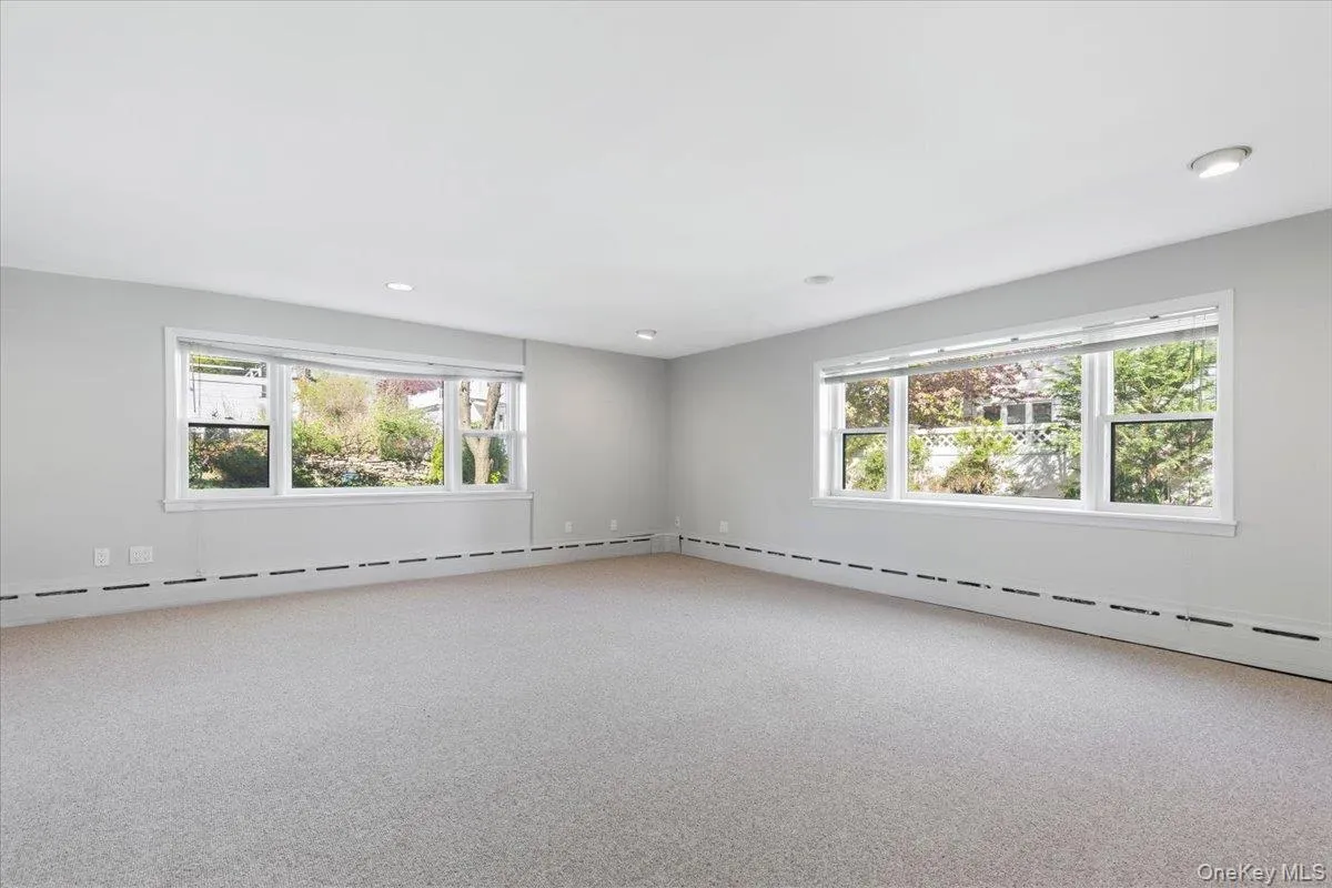 Versatile lower-level recreation room, perfect as a playroom or media space Versatile lower-level recreation room, perfect as a playroom or media space