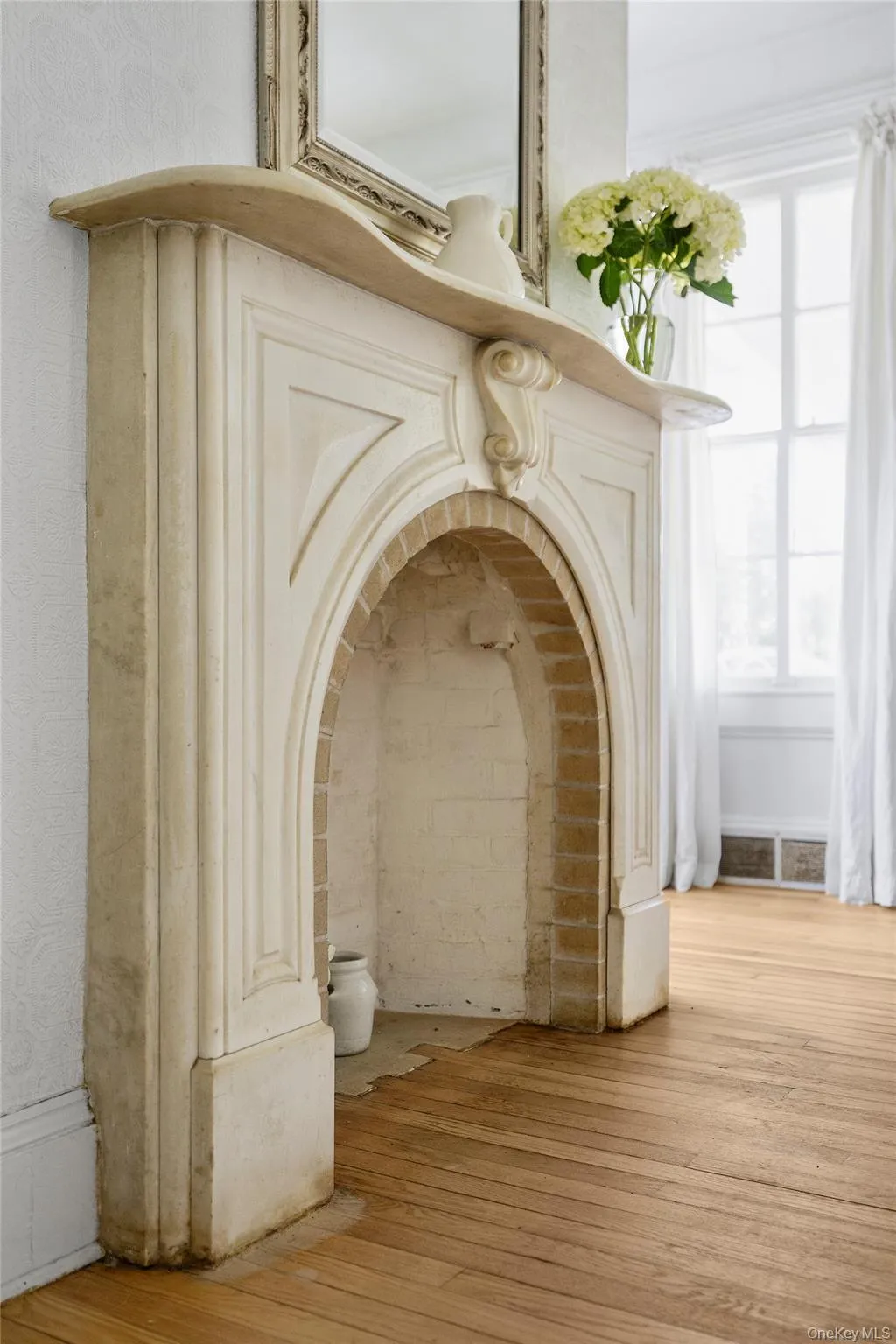 An 1870 hand carved marble fireplace mantle An 1870 hand carved marble fireplace mantle