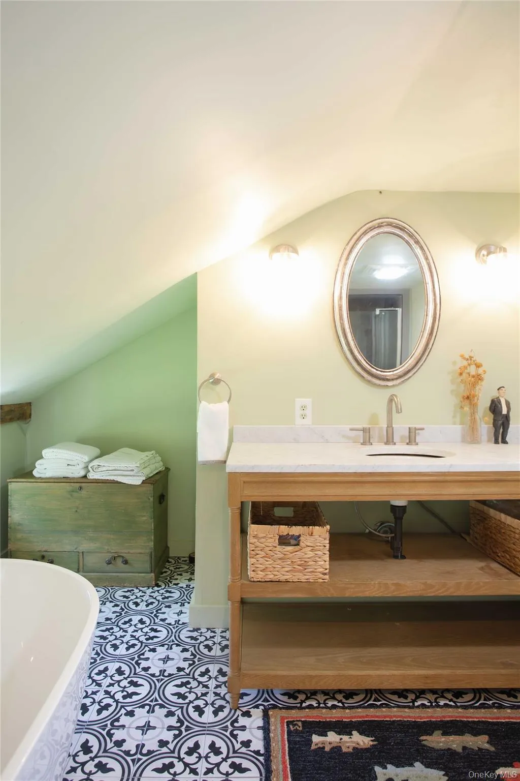 Bathroom featuring a vanity with a white stone countertop, undermount sink, and brushed nickel faucet Bathroom featuring a vanity with a white stone countertop, undermount sink, and brushed nickel faucet