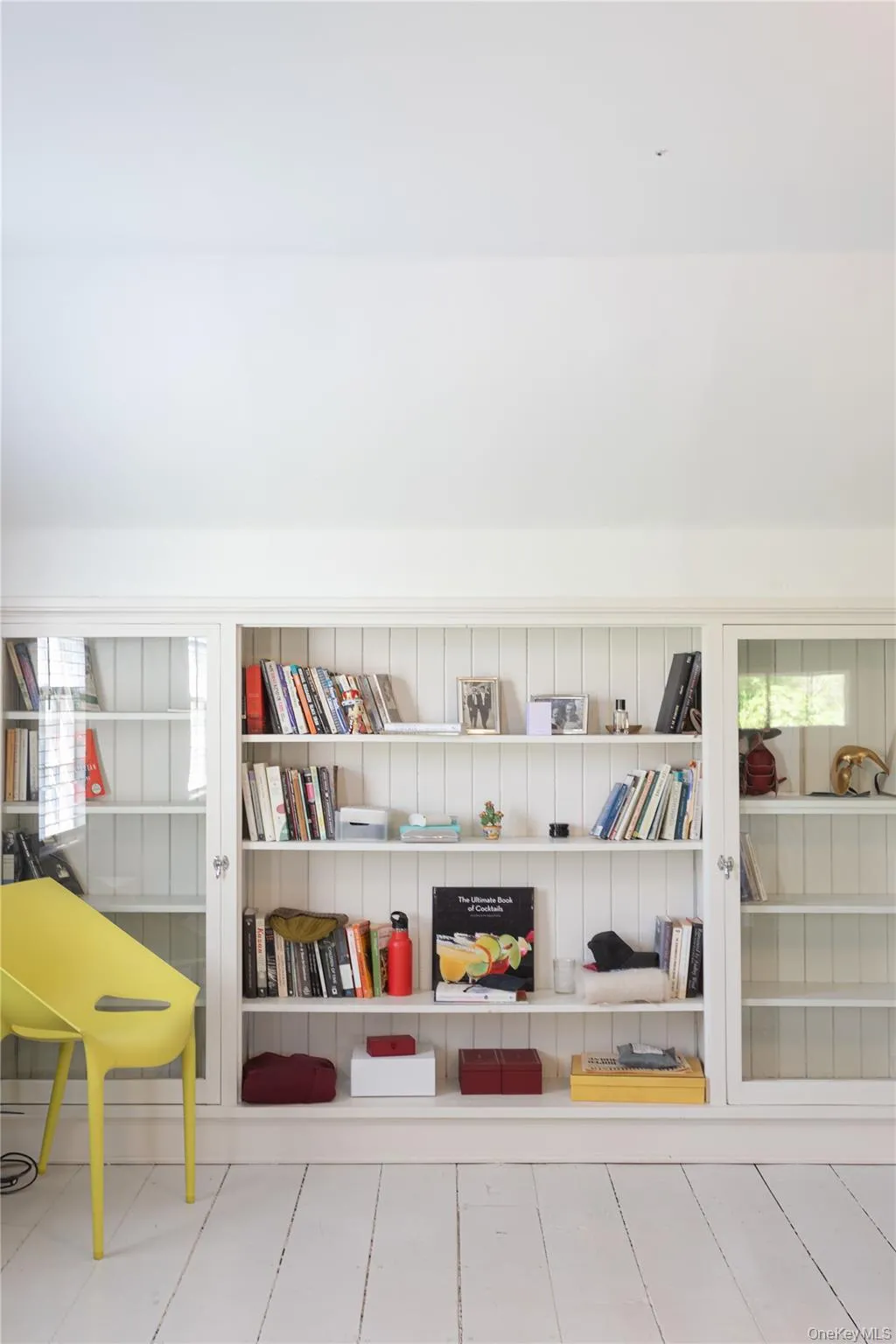 Built-in white shelving unit Built-in white shelving unit