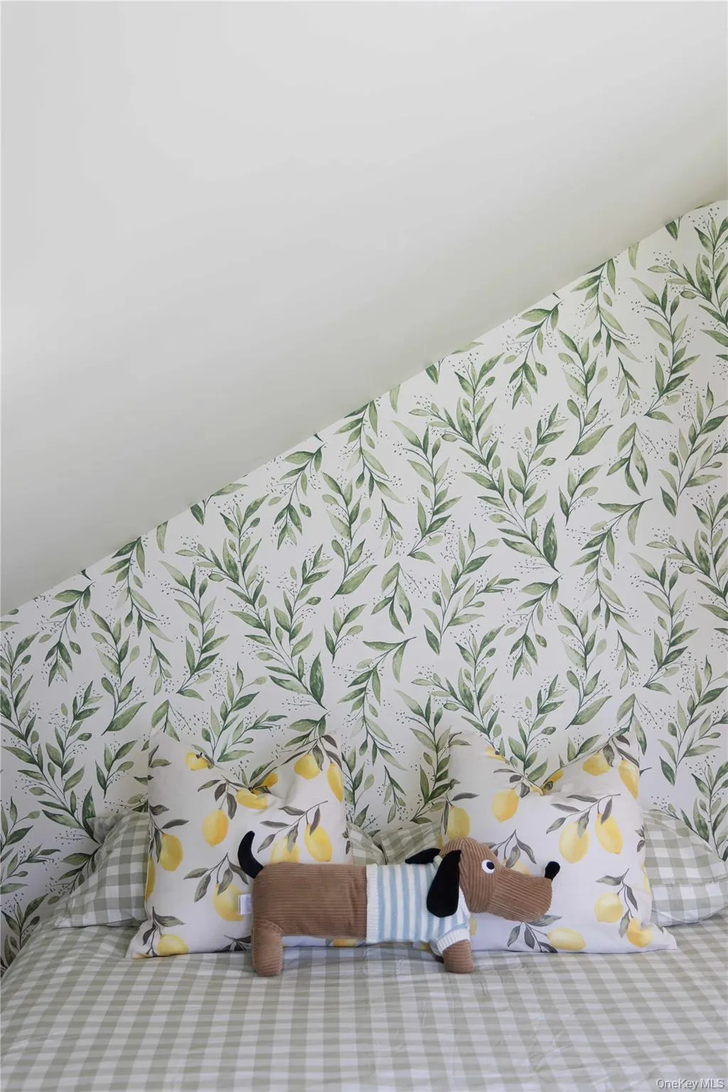 Angled wall bedroom featuring botanical-patterned wallpaper Angled wall bedroom featuring botanical-patterned wallpaper