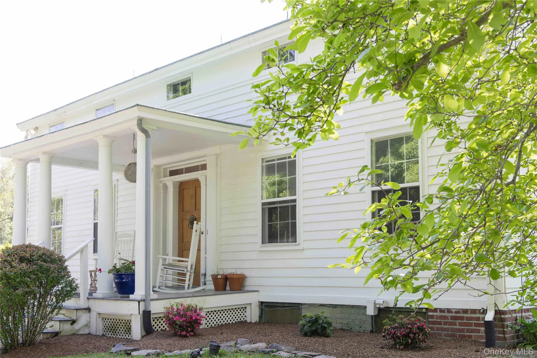 Front porch with landscaped surroundings Front porch with landscaped surroundings