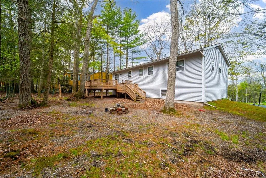The rear of the home features an elevated wooden deck The rear of the home features an elevated wooden deck