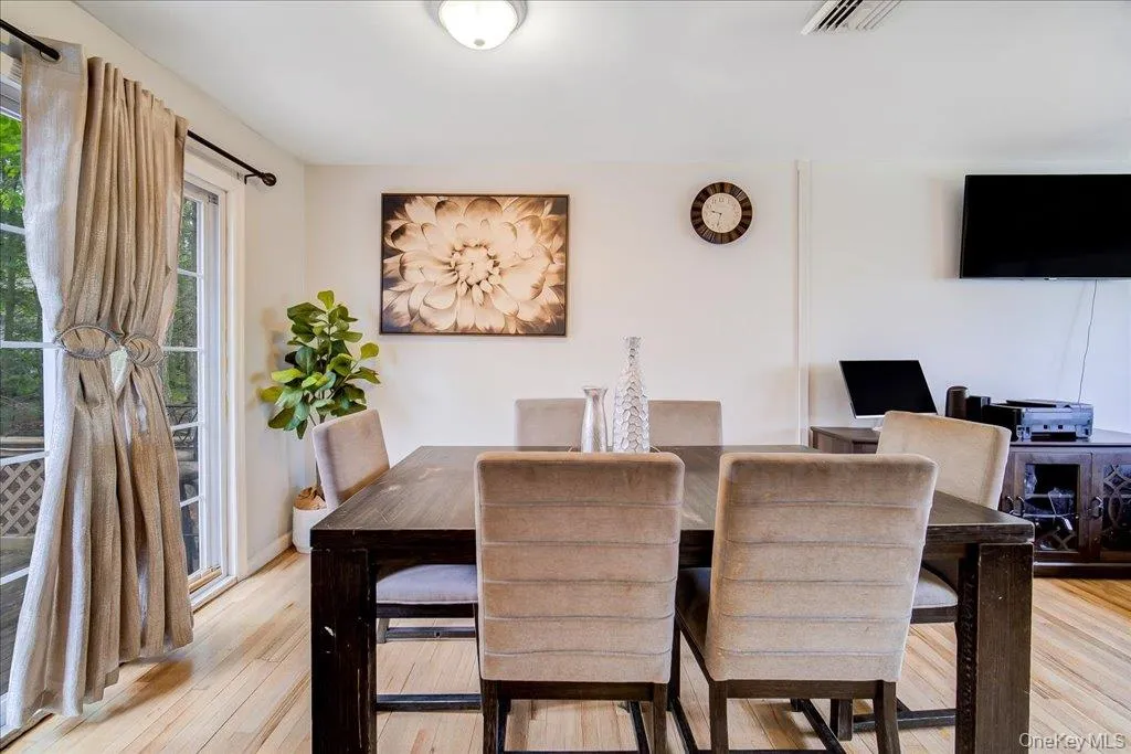The dining area flows seamlessly onto the back deck, perfect for effortless entertaining. The dining area flows seamlessly onto the back deck, perfect for effortless entertaining.