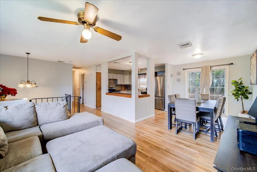 open-concept floor plan that seamlessly integrates the living room, dining area, and kitchen. open-concept floor plan that seamlessly integrates the living room, dining area, and kitchen.