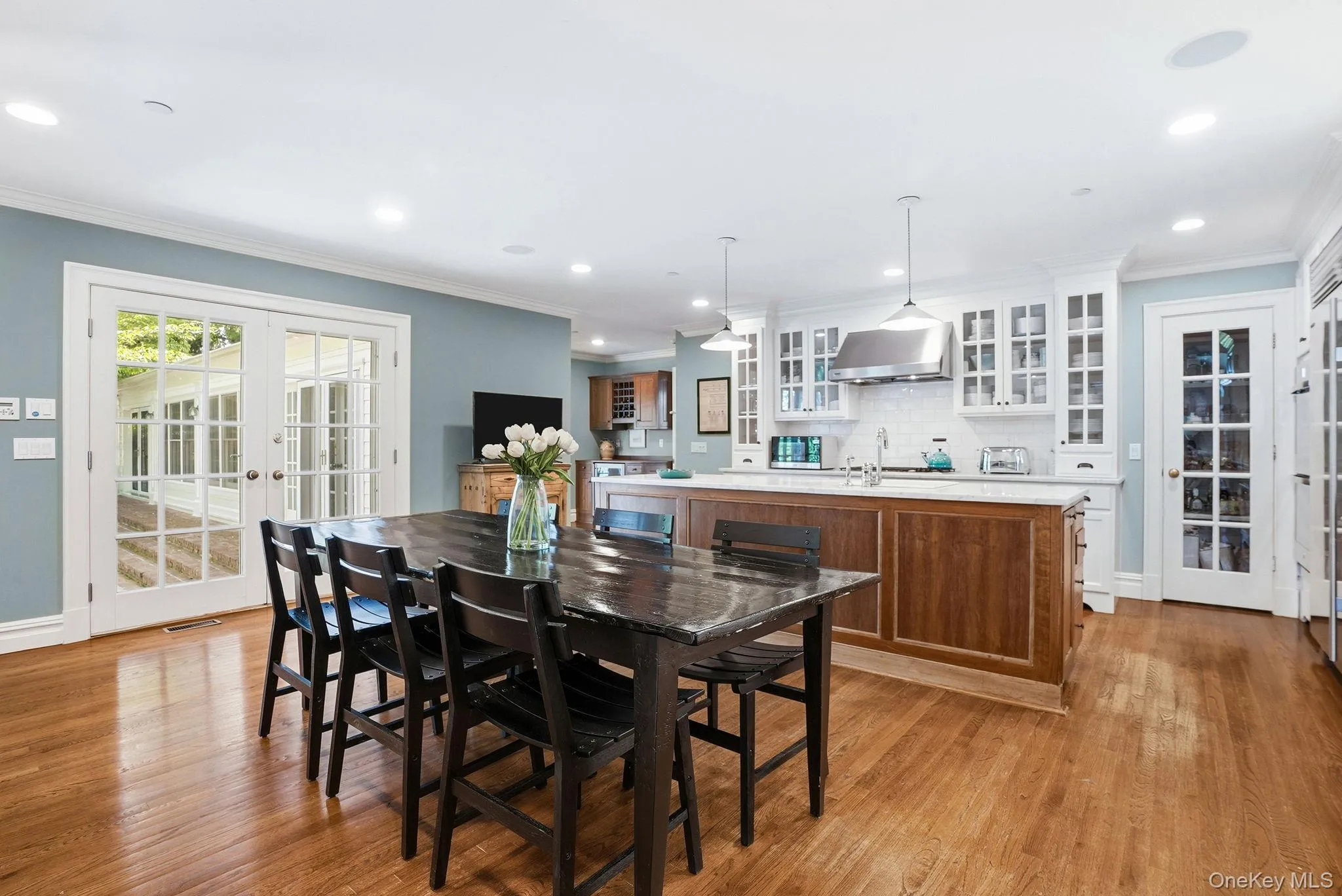 Expansive Kitchen and Pantry with Fireplace and Doors to Outside Terrace Expansive Kitchen and Pantry with Fireplace and Doors to Outside Terrace