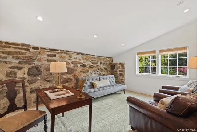 The cozy den/office with the unique rock foundation wall. The cozy den/office with the unique rock foundation wall.