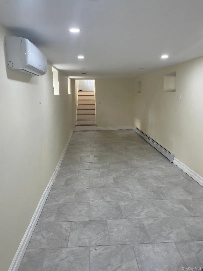 Finished Basement with Gree Unitand ceramic tiles and Baseboard Finished Basement with Gree Unitand ceramic tiles and Baseboard