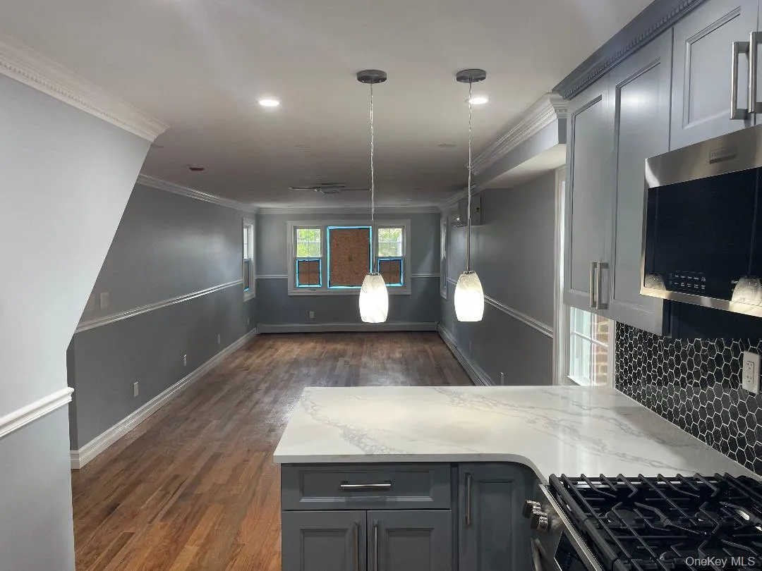 Kitchen with Cabinetry and Stainless Steel Appliances and Lighting Kitchen with Cabinetry and Stainless Steel Appliances and Lighting