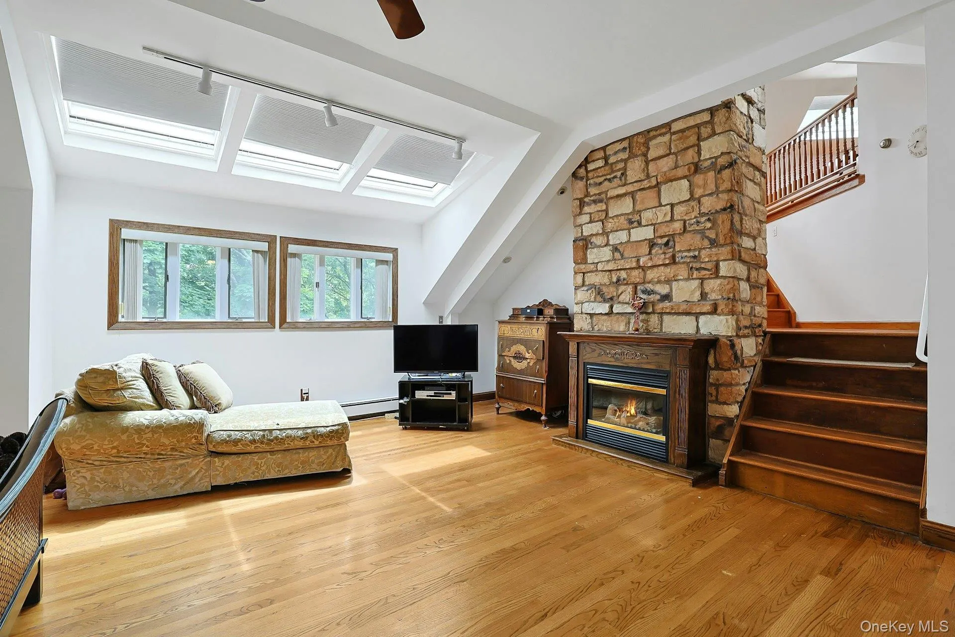 Sitting area of primary bedroom with steps leading to loft Sitting area of primary bedroom with steps leading to loft