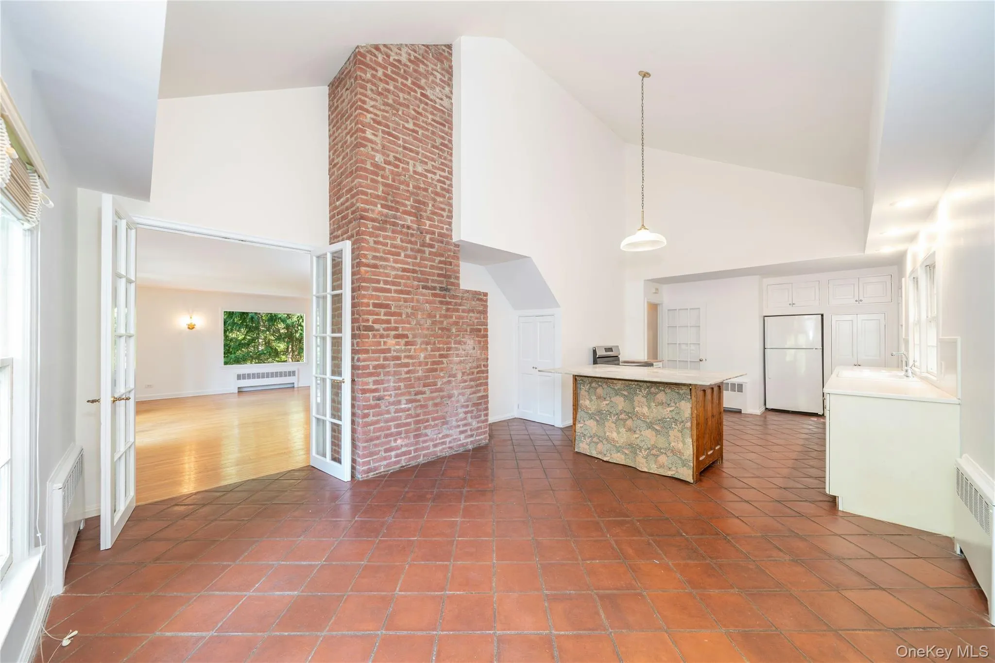 Large kitchen with vaulted ceiling and dining area. Large kitchen with vaulted ceiling and dining area.