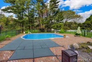 In-Ground Pool within designated Fenced in area. *Pool water edited with AI* In-Ground Pool within designated Fenced in area. *Pool water edited with AI*