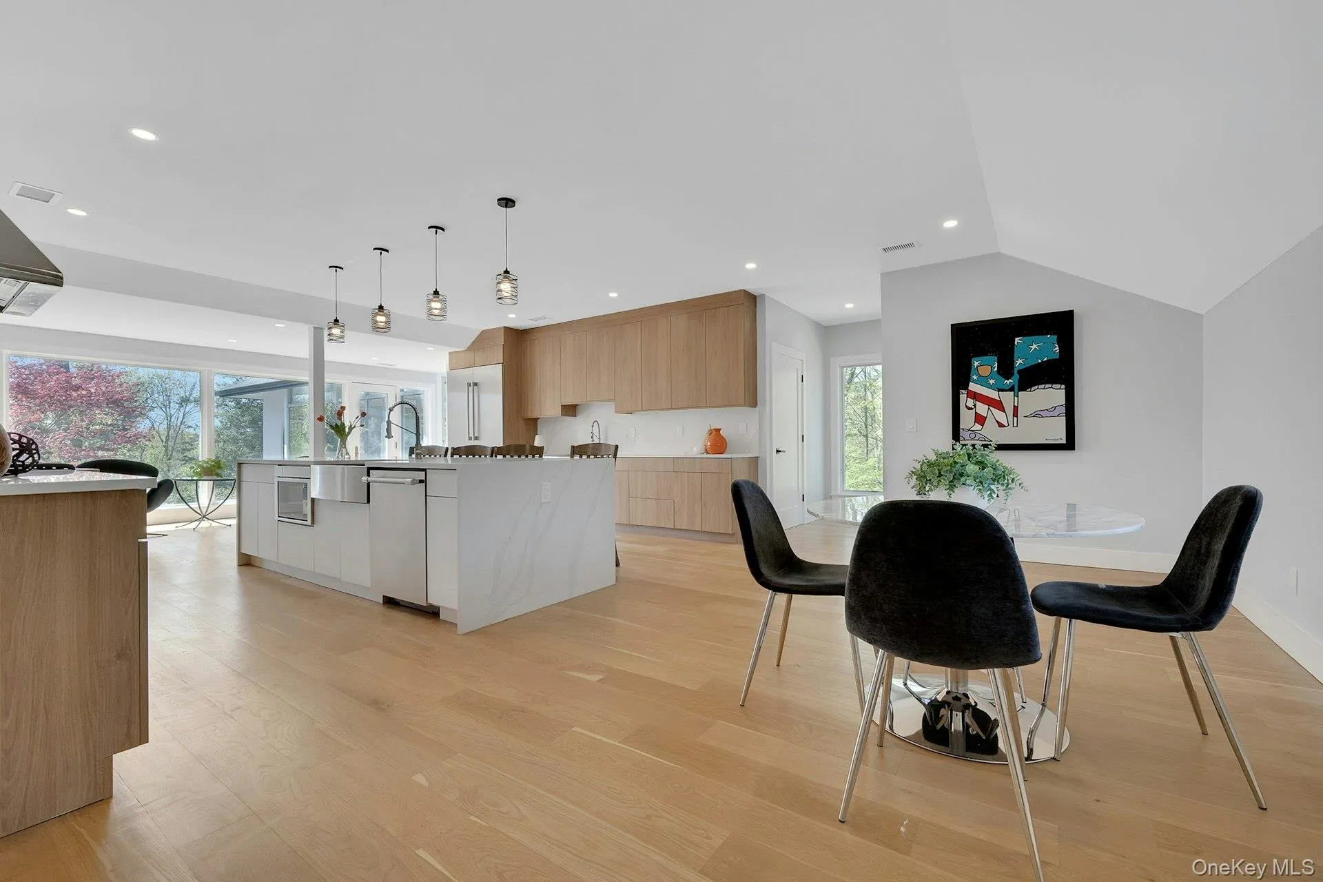 Open-concept kitchen with large center island and quartz countertops Open-concept kitchen with large center island and quartz countertops