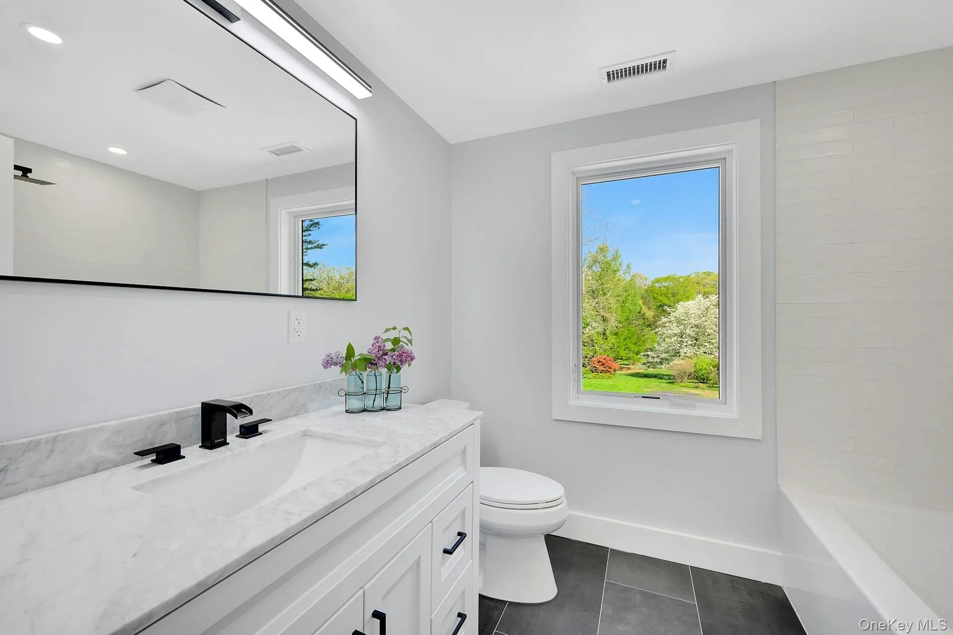 Bright and tastefully-decorated second floor bathroom Bright and tastefully-decorated second floor bathroom