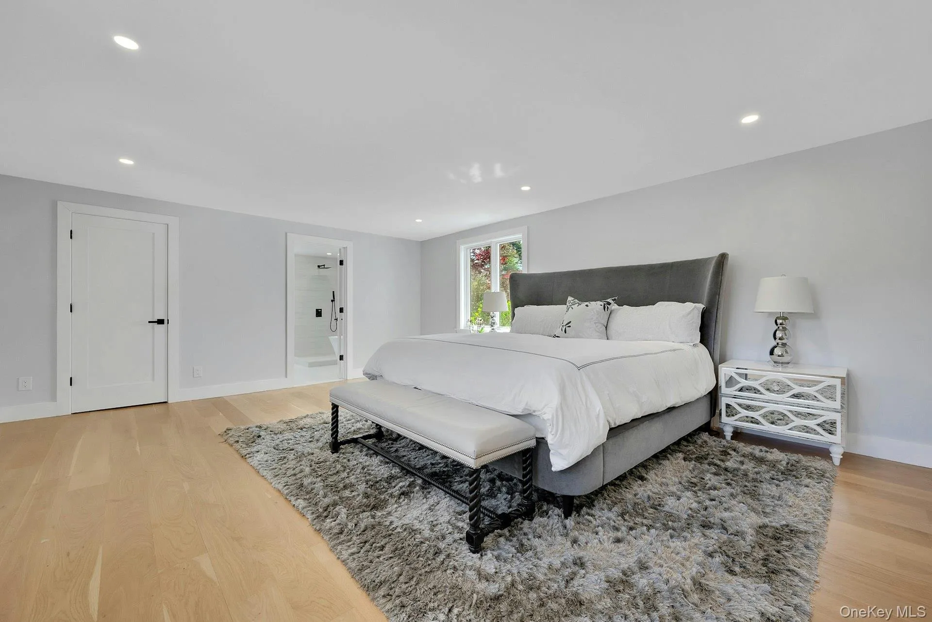Spacious and serene primary bedroom on first floor Spacious and serene primary bedroom on first floor