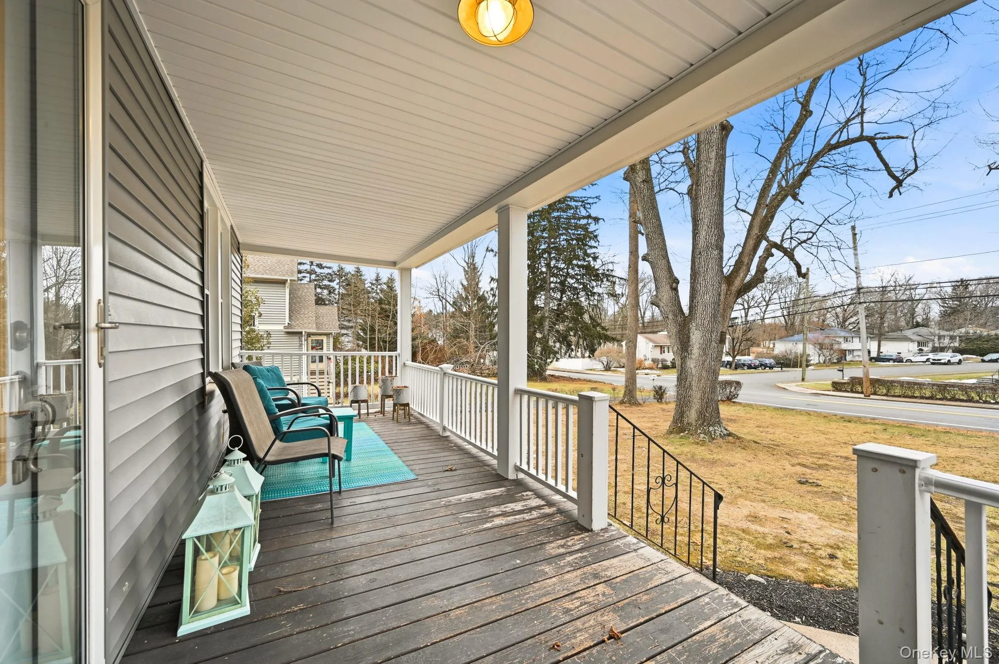 Wooden porch featuring a residential view Wooden porch featuring a residential view