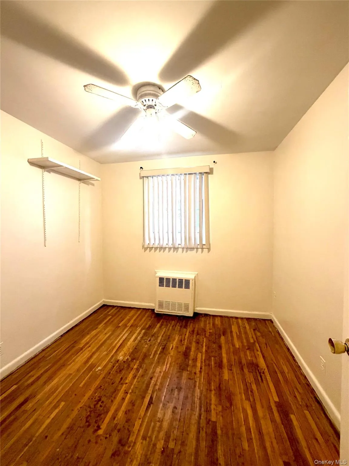 3rd bedroom- Junior size room featuring wood-finish flooring and neutral wall tones 3rd bedroom- Junior size room featuring wood-finish flooring and neutral wall tones