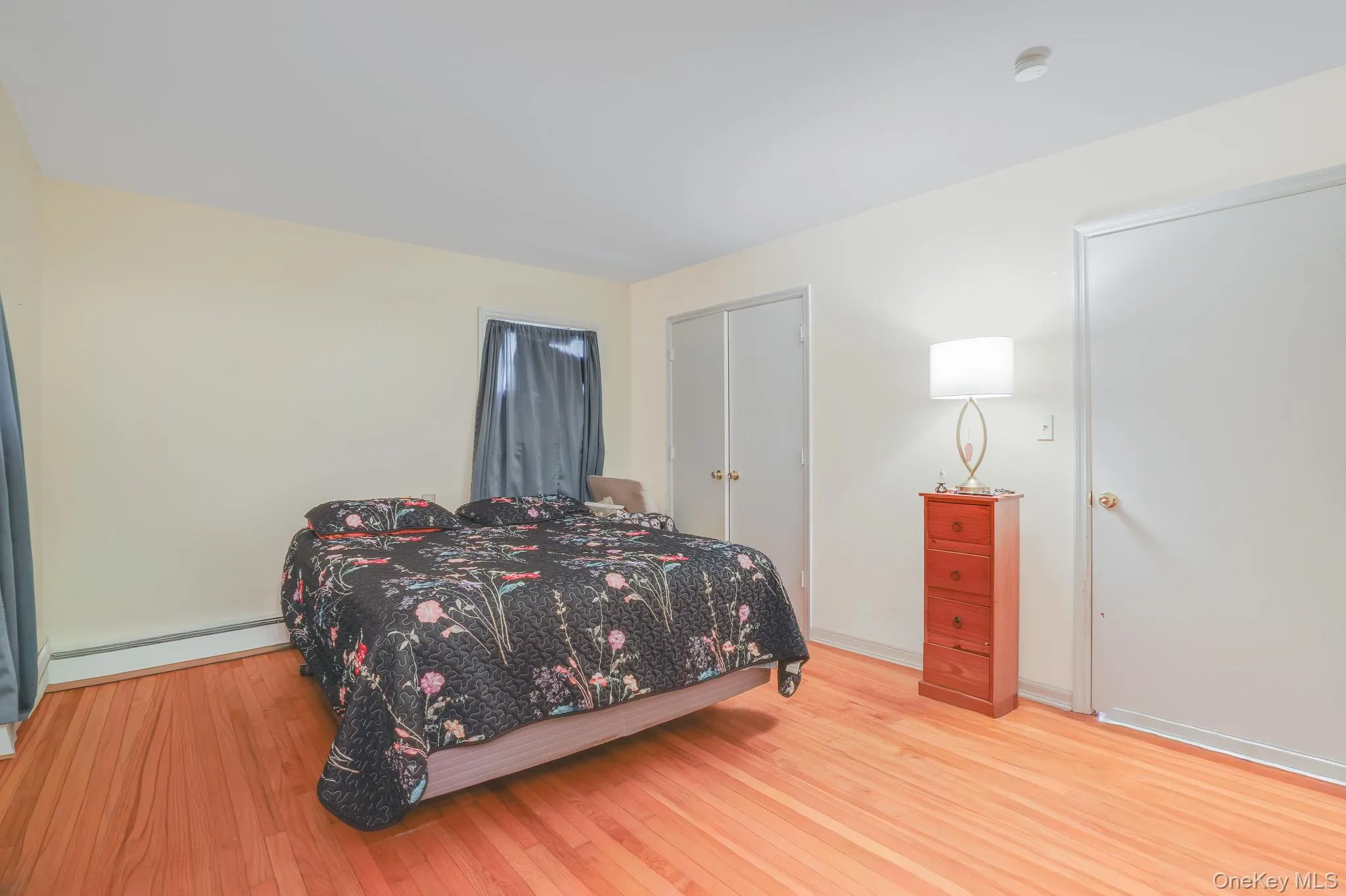 Light-toned walls complement wood-finish flooring throughout this room Light-toned walls complement wood-finish flooring throughout this room