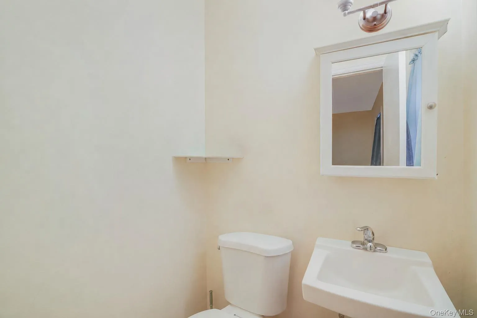 White wall-mounted sink with chrome faucet White wall-mounted sink with chrome faucet