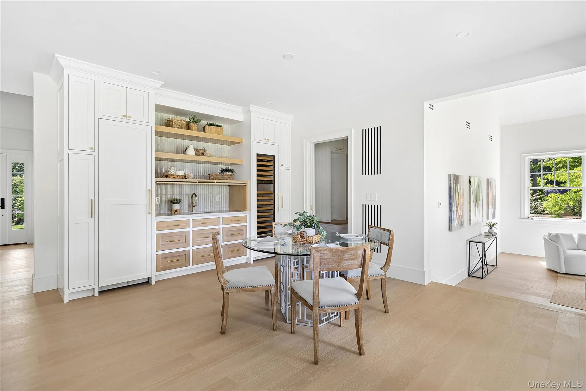Built-in wet bar featuring a beverage refrigerator, wine storage, open shelving, and a tiled backsplash Built-in wet bar featuring a beverage refrigerator, wine storage, open shelving, and a tiled backsplash