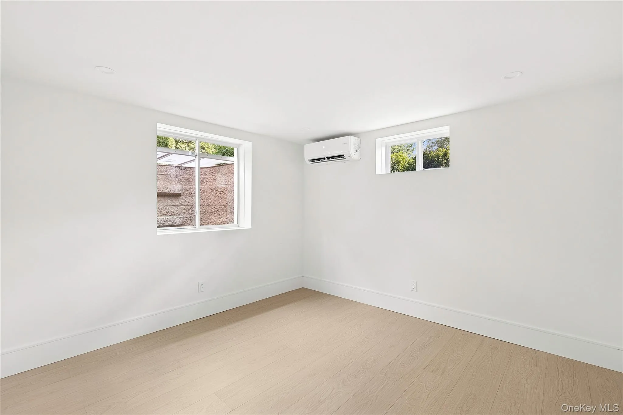 Light wood-finish flooring complements crisp white walls Light wood-finish flooring complements crisp white walls
