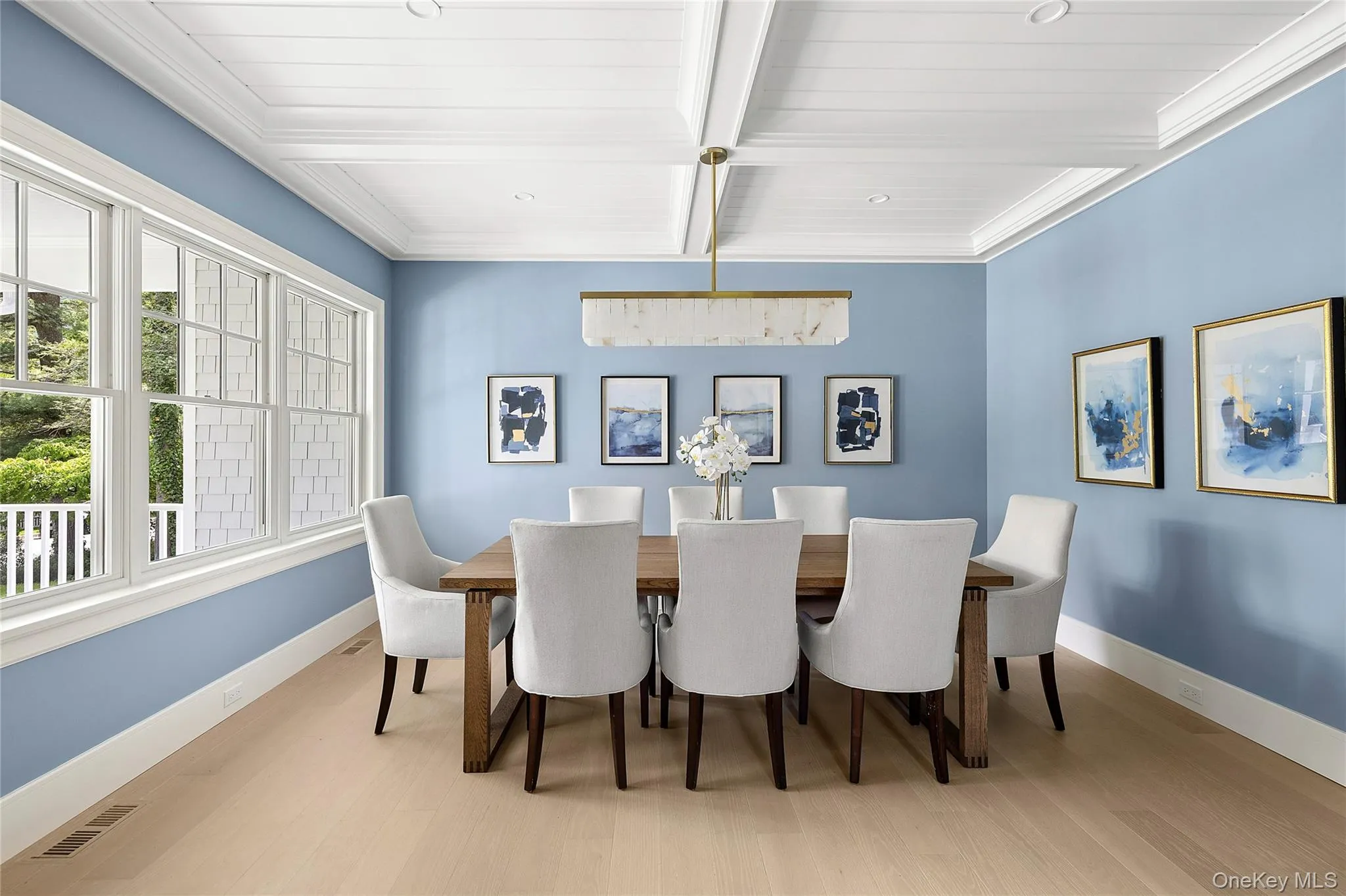 Light wood-finish flooring complements the detailed coffered ceiling Light wood-finish flooring complements the detailed coffered ceiling