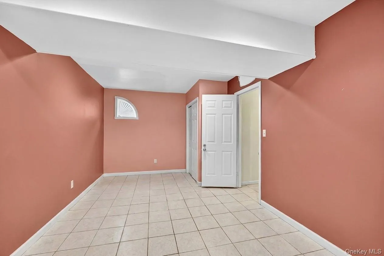 Bonus room with light tile patterned floors Bonus room with light tile patterned floors