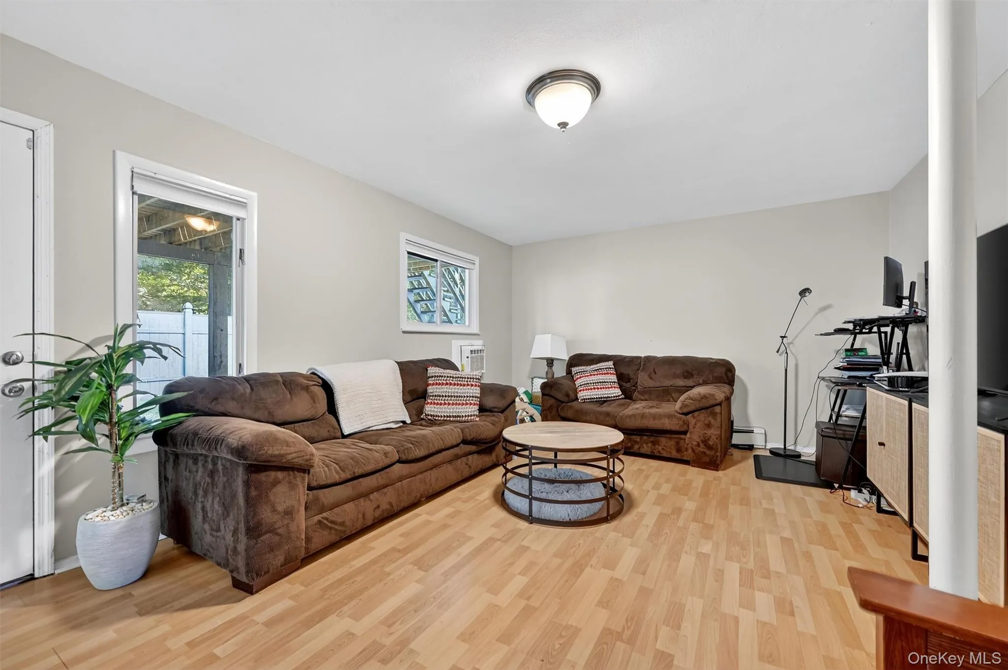 Family room featuring healthy amount of natural light and light wood-type flooring Family room featuring healthy amount of natural light and light wood-type flooring
