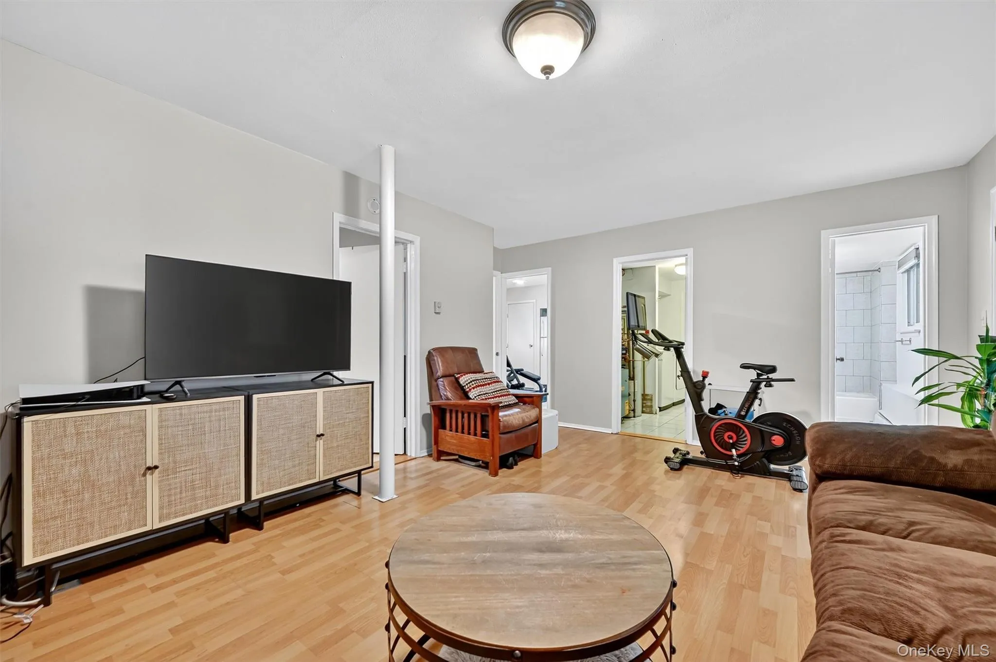 Family room featuring light wood finished floors and baseboards Family room featuring light wood finished floors and baseboards
