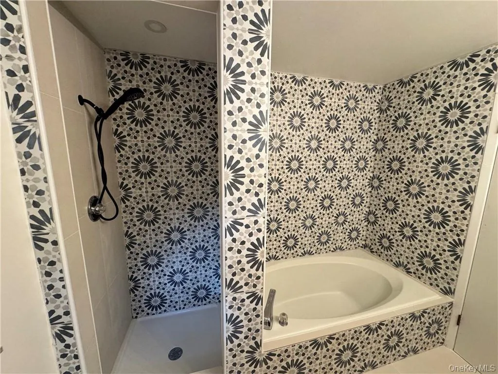 Gorgeous new tile in primary bathroom Gorgeous new tile in primary bathroom