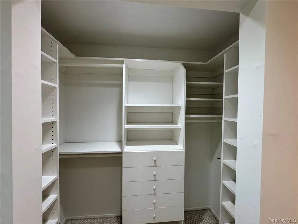 Spacious walk in closet in primary suite Spacious walk in closet in primary suite