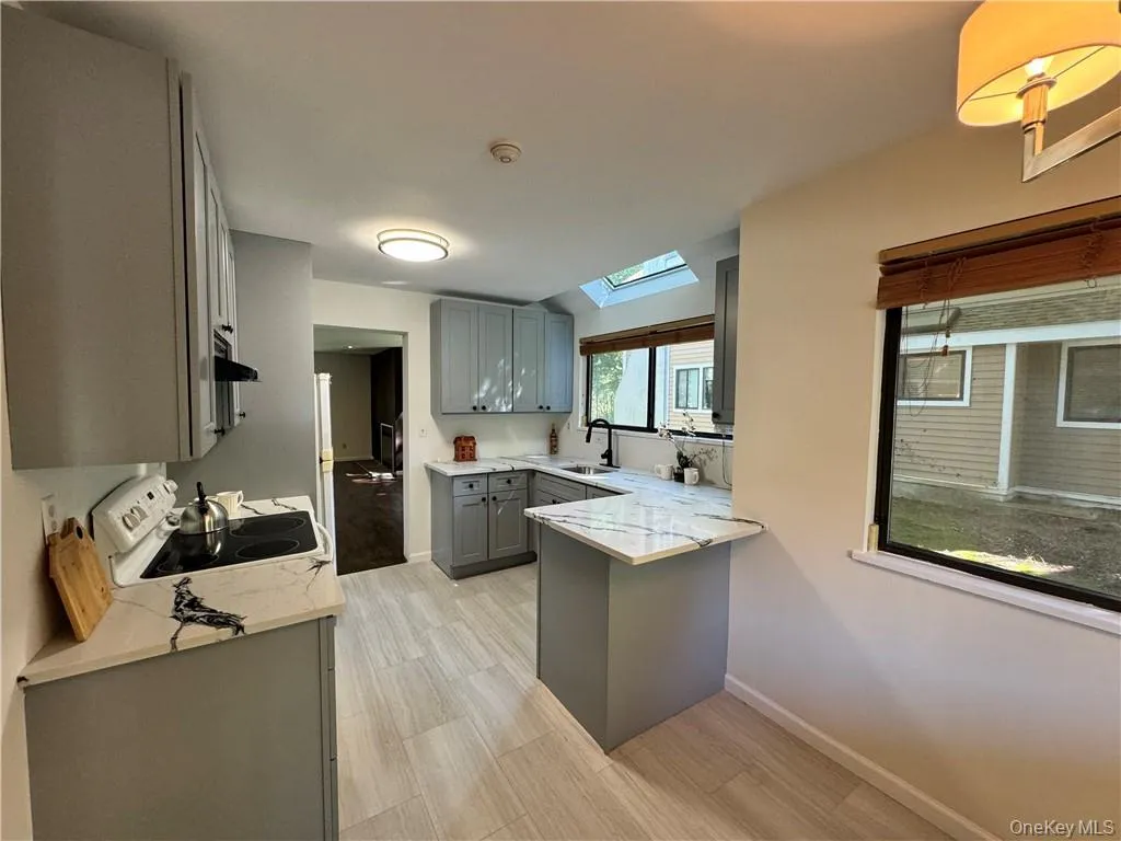 Brand new gray cabinetry, new stone countertops and gorgeous new flooring Brand new gray cabinetry, new stone countertops and gorgeous new flooring