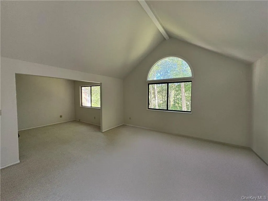 Extraordinarily spacious en suite primary bedroom with dramatic vaulted ceiling has adjacent room that could be used for home office/nursery/fitness room Extraordinarily spacious en suite primary bedroom with dramatic vaulted ceiling has adjacent room that could be used for home office/nursery/fitness room