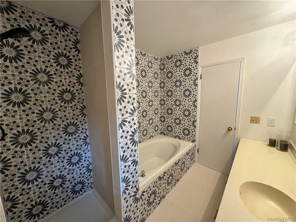 Newly updated primary bathroom with shower with separate bathtub Newly updated primary bathroom with shower with separate bathtub