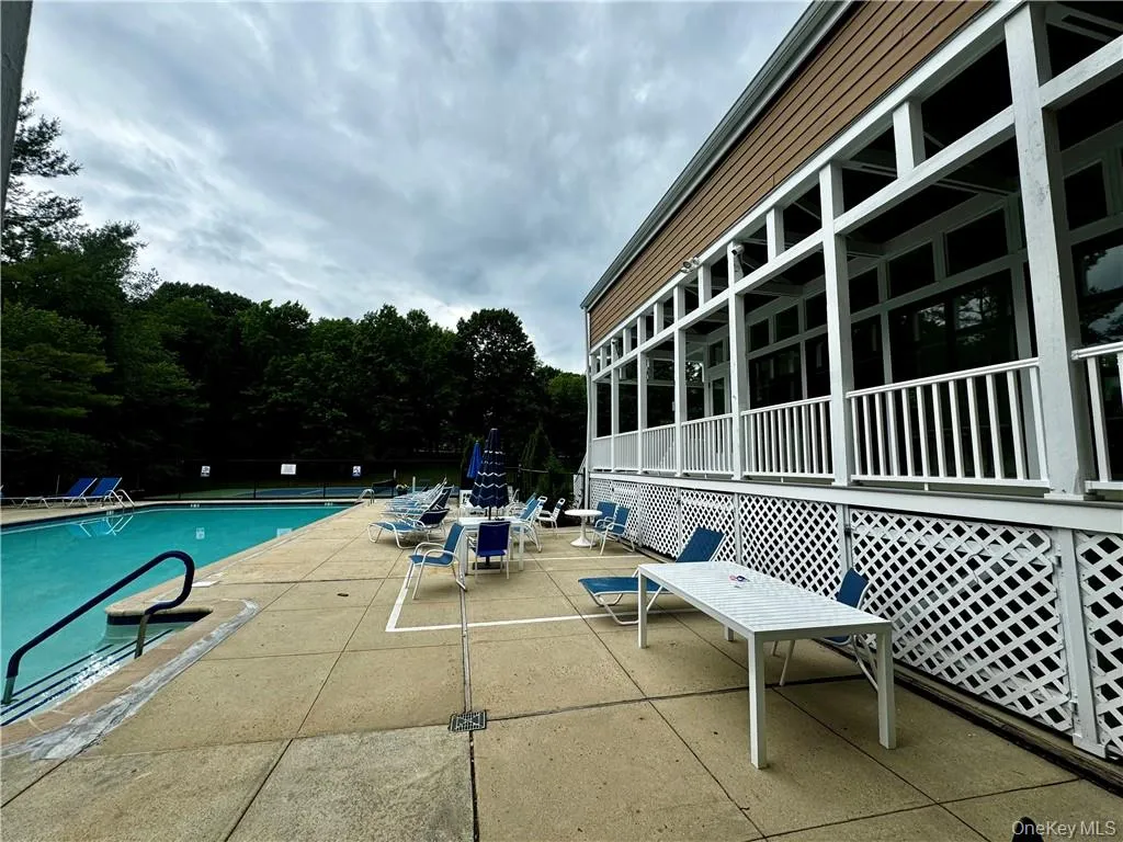 View of swimming pool and clubhouse View of swimming pool and clubhouse