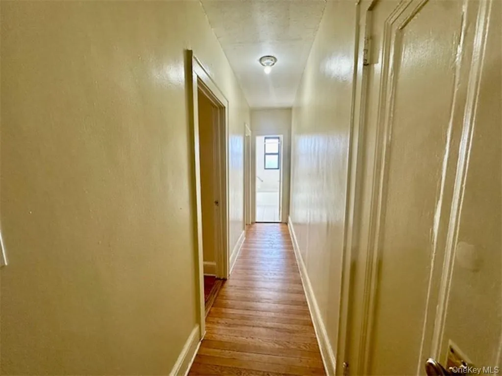 Hallway featuring light hardwood / wood-style floors Hallway featuring light hardwood / wood-style floors