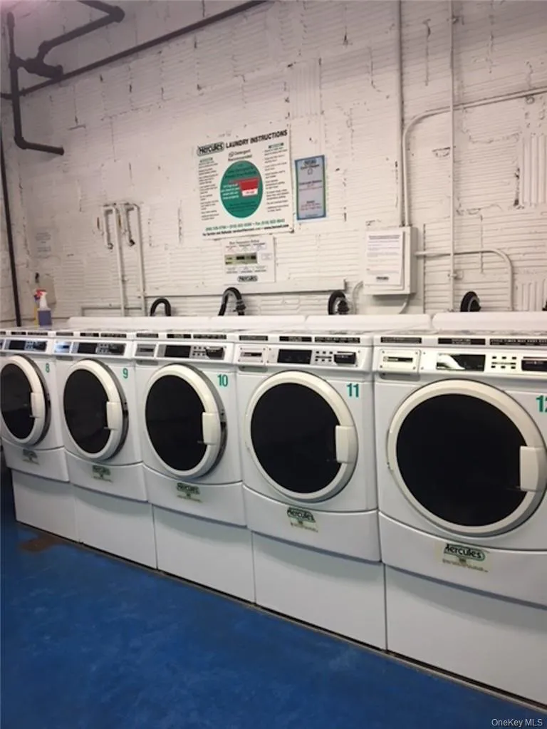 Laundry room featuring washing machine and clothes dryer Laundry room featuring washing machine and clothes dryer
