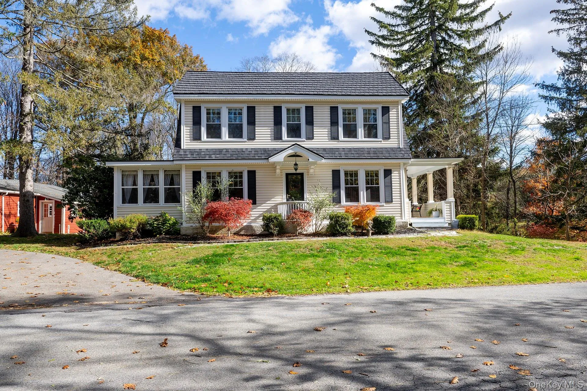 View of front of home featuring covered porch and a front lawn View of front of home featuring covered porch and a front lawn