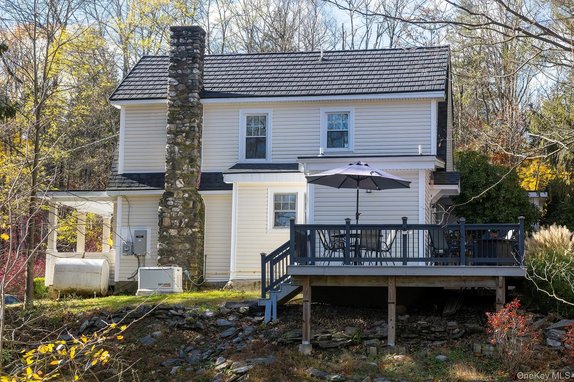 Rear view of property with a deck Rear view of property with a deck
