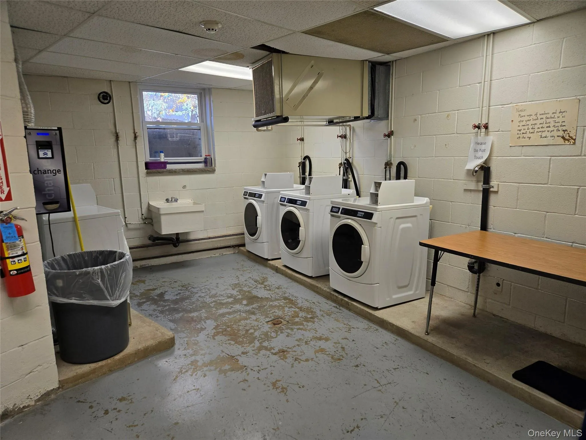 Laundry area featuring sink and washer and dryer Laundry area featuring sink and washer and dryer