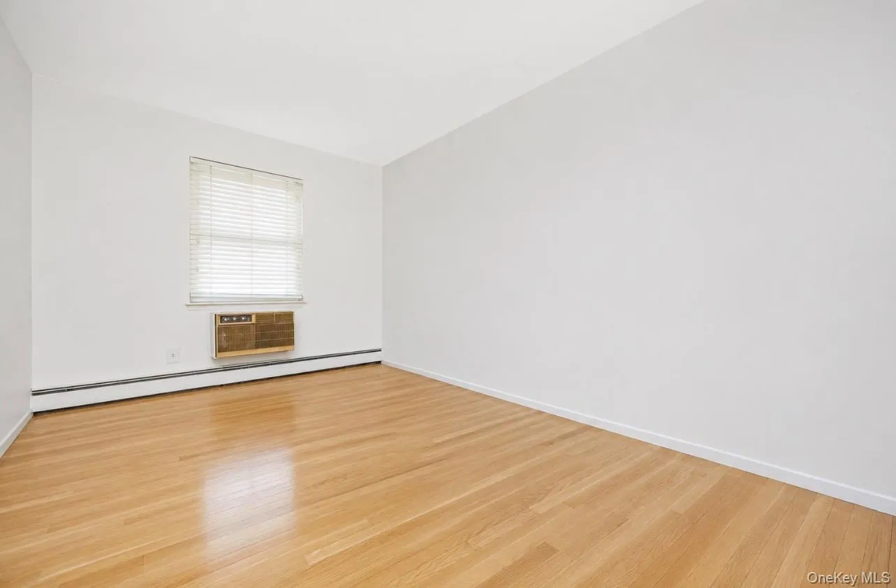Secondary bedroom staged with hardwood floors Secondary bedroom staged with hardwood floors