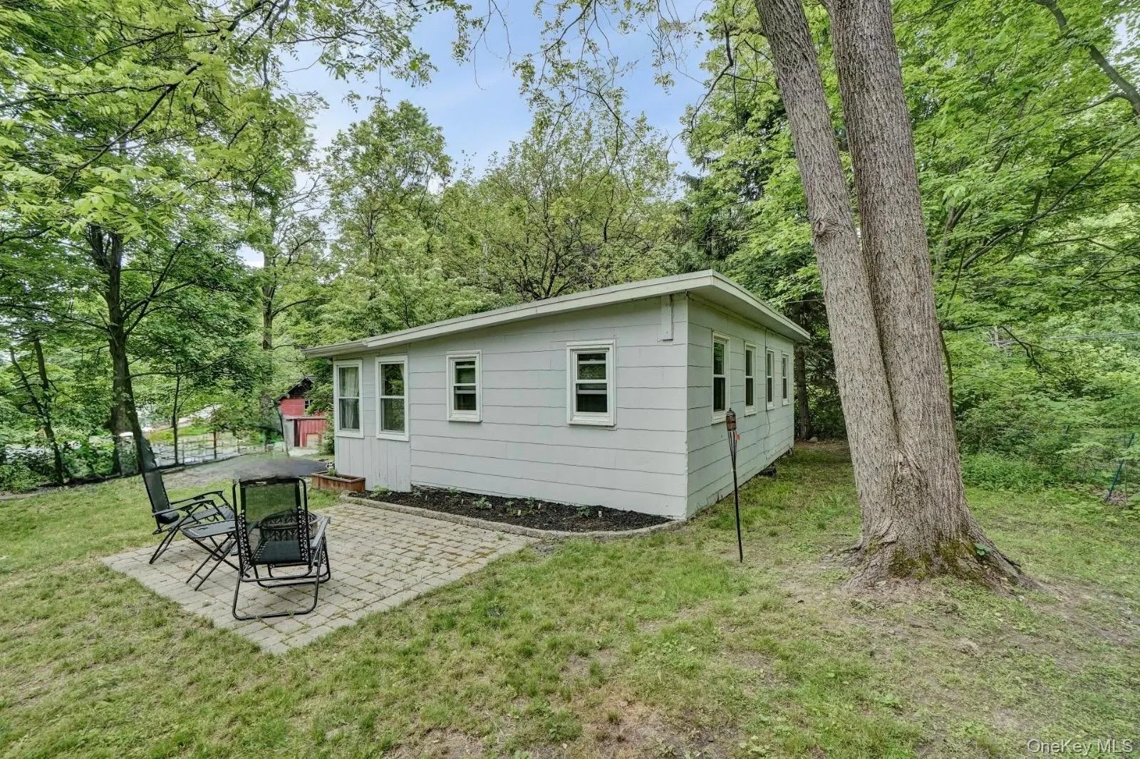 Back of property featuring a patio and a yard Back of property featuring a patio and a yard