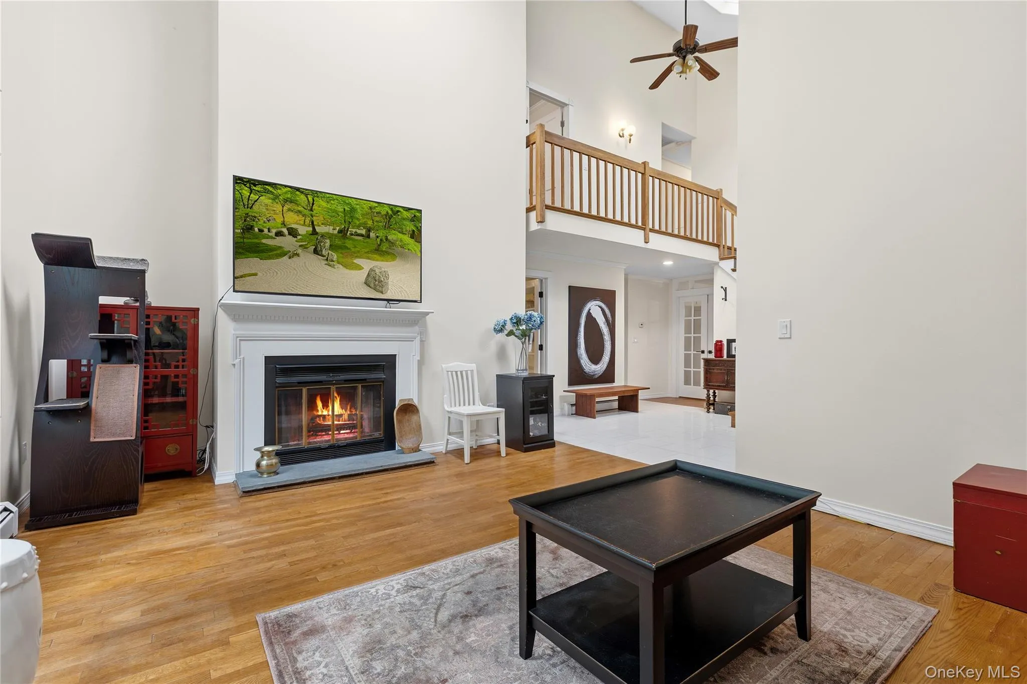 Living room with fireplace virtually lit. Fireplace was never used Living room with fireplace virtually lit. Fireplace was never used